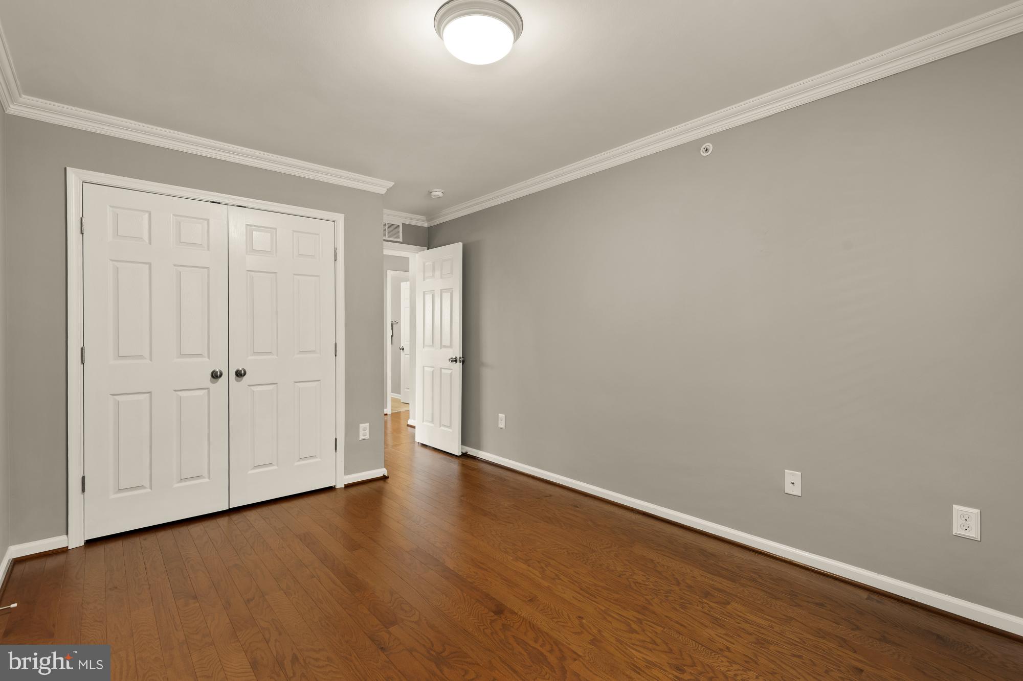15611 Coolidge Avenue Silver Spring, MD 20906 - Photo 35 of 57 a view of an empty room with wooden floor