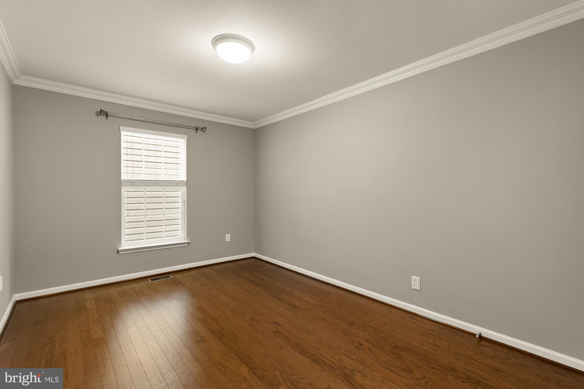 15611 Coolidge Avenue Silver Spring, MD 20906 - Photo 36 of 57 wooden floor in an empty room with a window