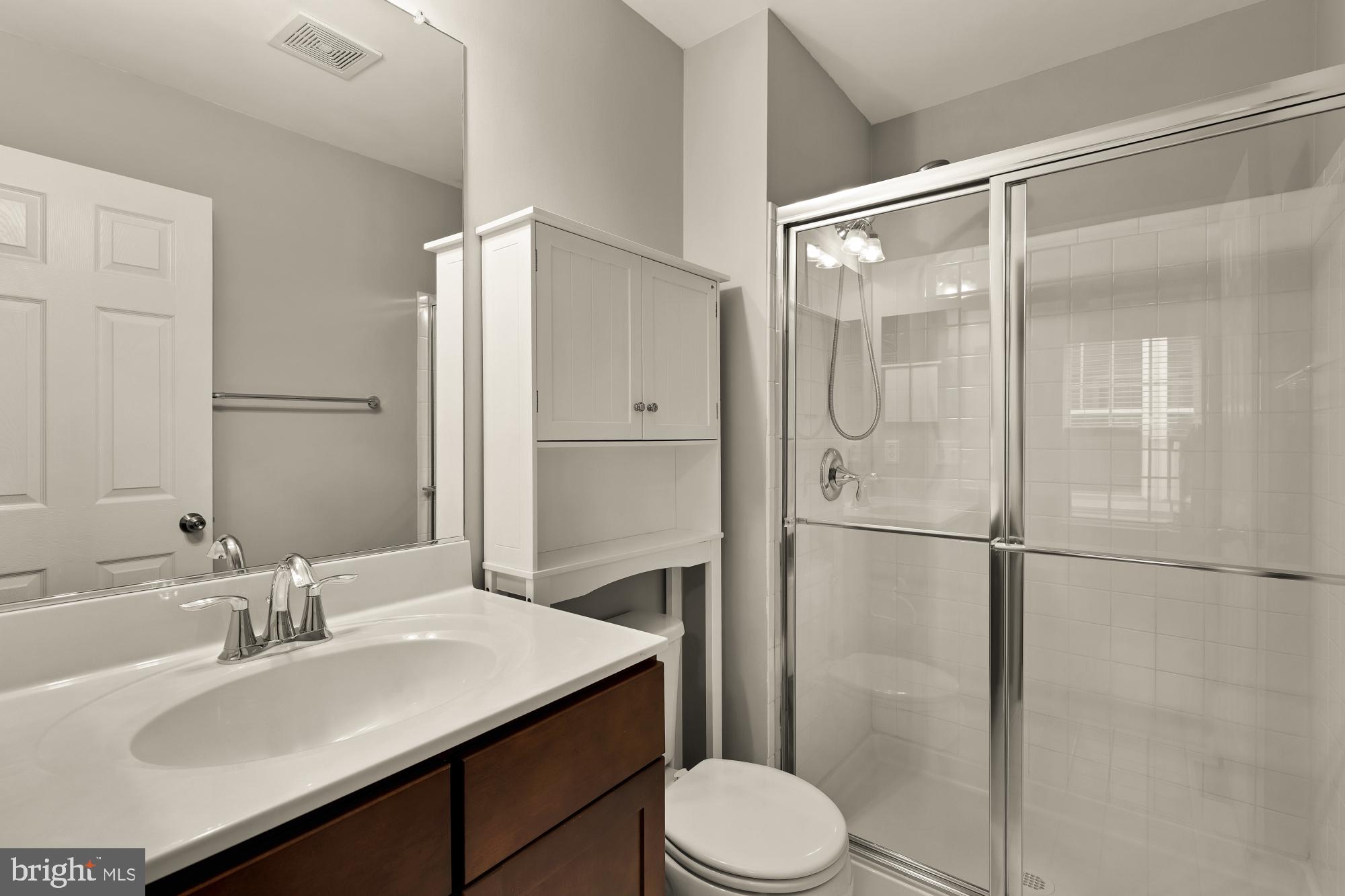 15611 Coolidge Avenue Silver Spring, MD 20906 - Photo 41 of 57 a bathroom with a sink toilet and shower