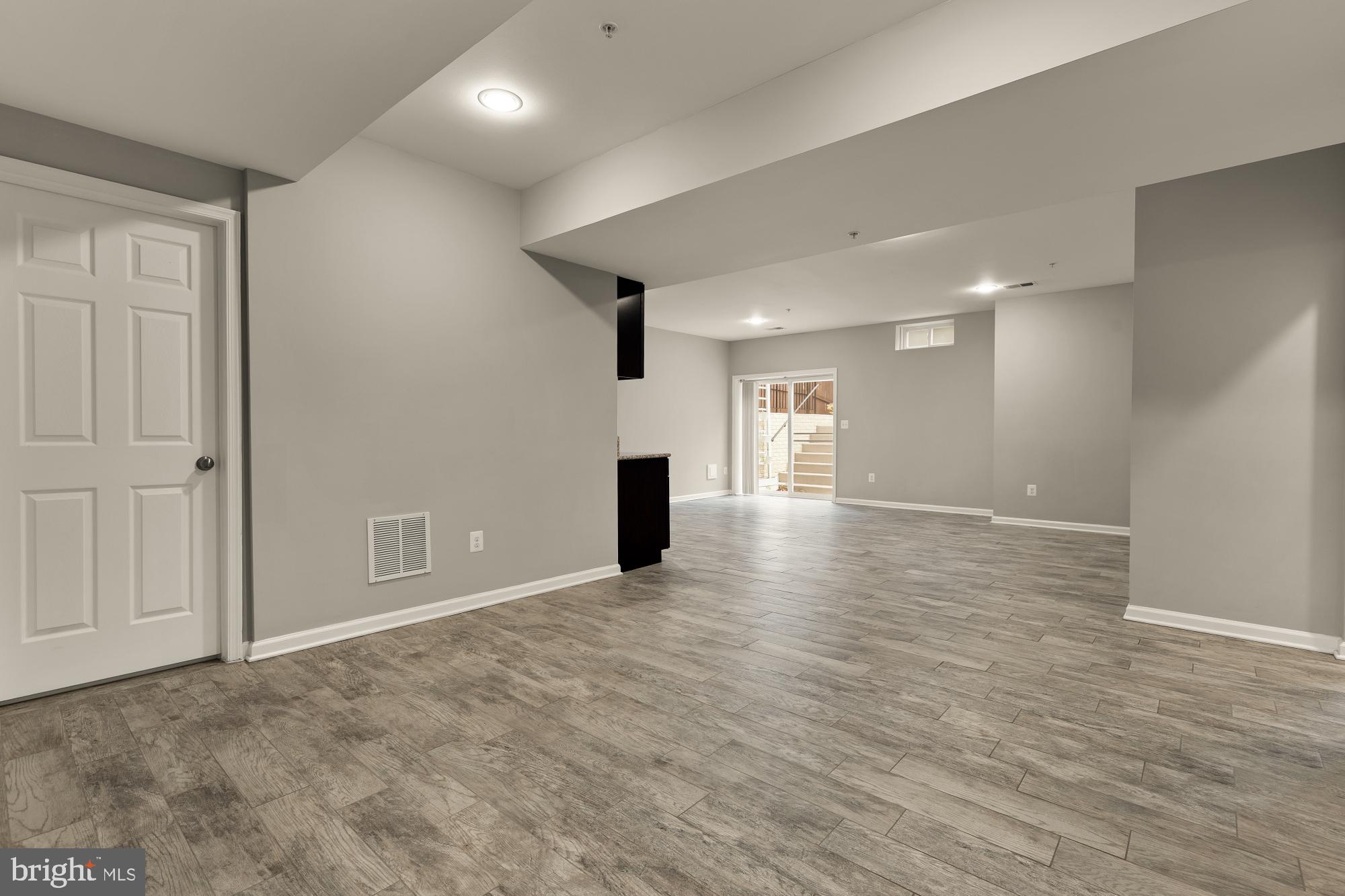 15611 Coolidge Avenue Silver Spring, MD 20906 - Photo 46 of 57 wooden floor in an empty room with a window