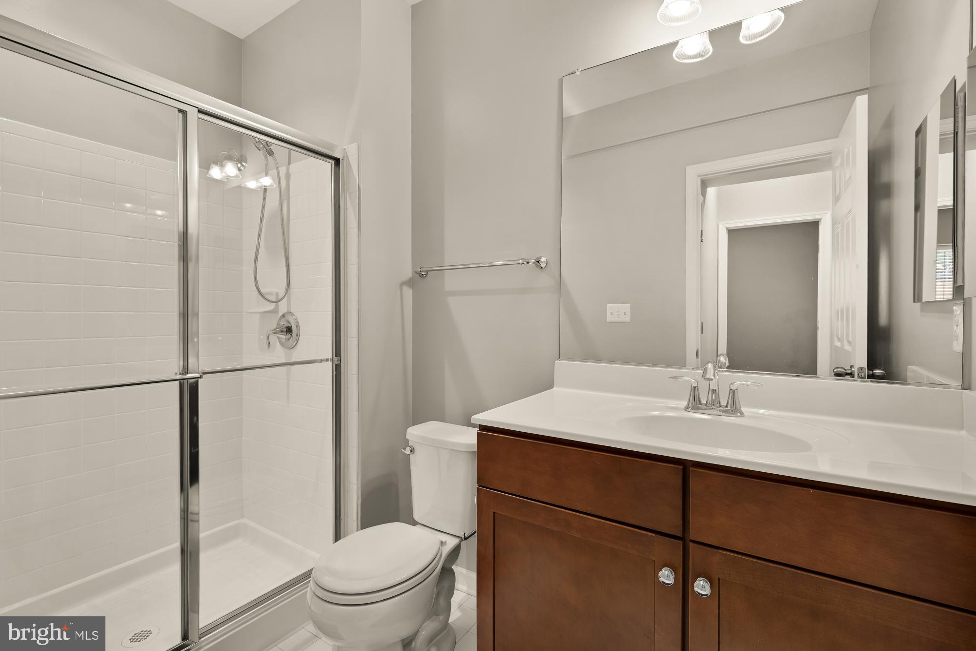 15611 Coolidge Avenue Silver Spring, MD 20906 - Photo 49 of 57 a bathroom with a sink a toilet and a mirror