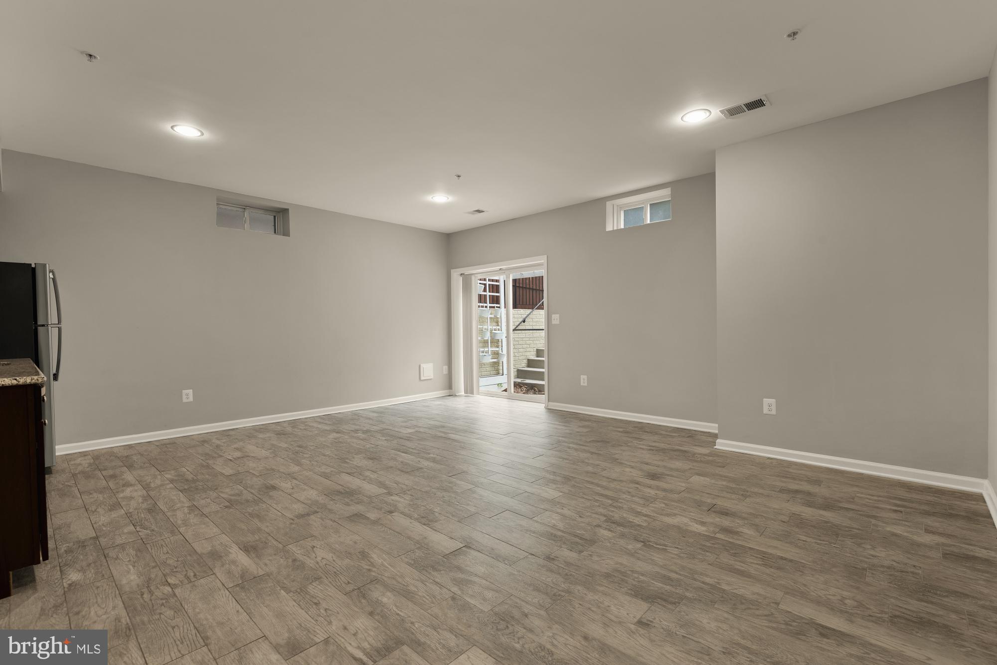 15611 Coolidge Avenue Silver Spring, MD 20906 - Photo 54 of 57 a view of an empty room with wooden floor