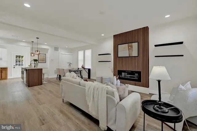 a living room with furniture and a lamp