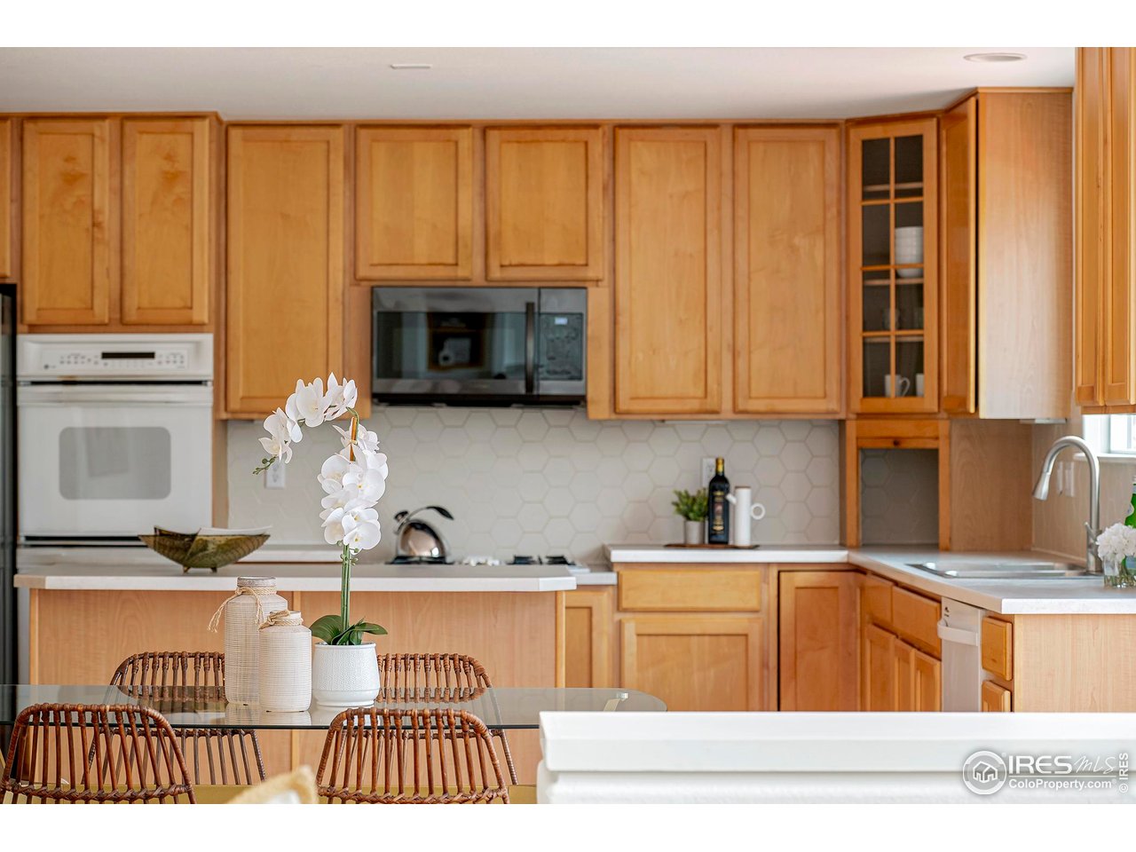 1414 Hoffman Drive Erie, CO 80516 - Photo 12 of 37 a kitchen with stainless steel appliances granite countertop a stove and a sink