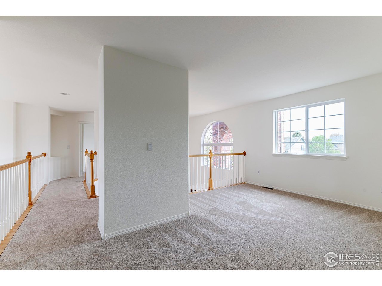 1414 Hoffman Drive Erie, CO 80516 - Photo 19 of 37 a view of empty room with wooden floor