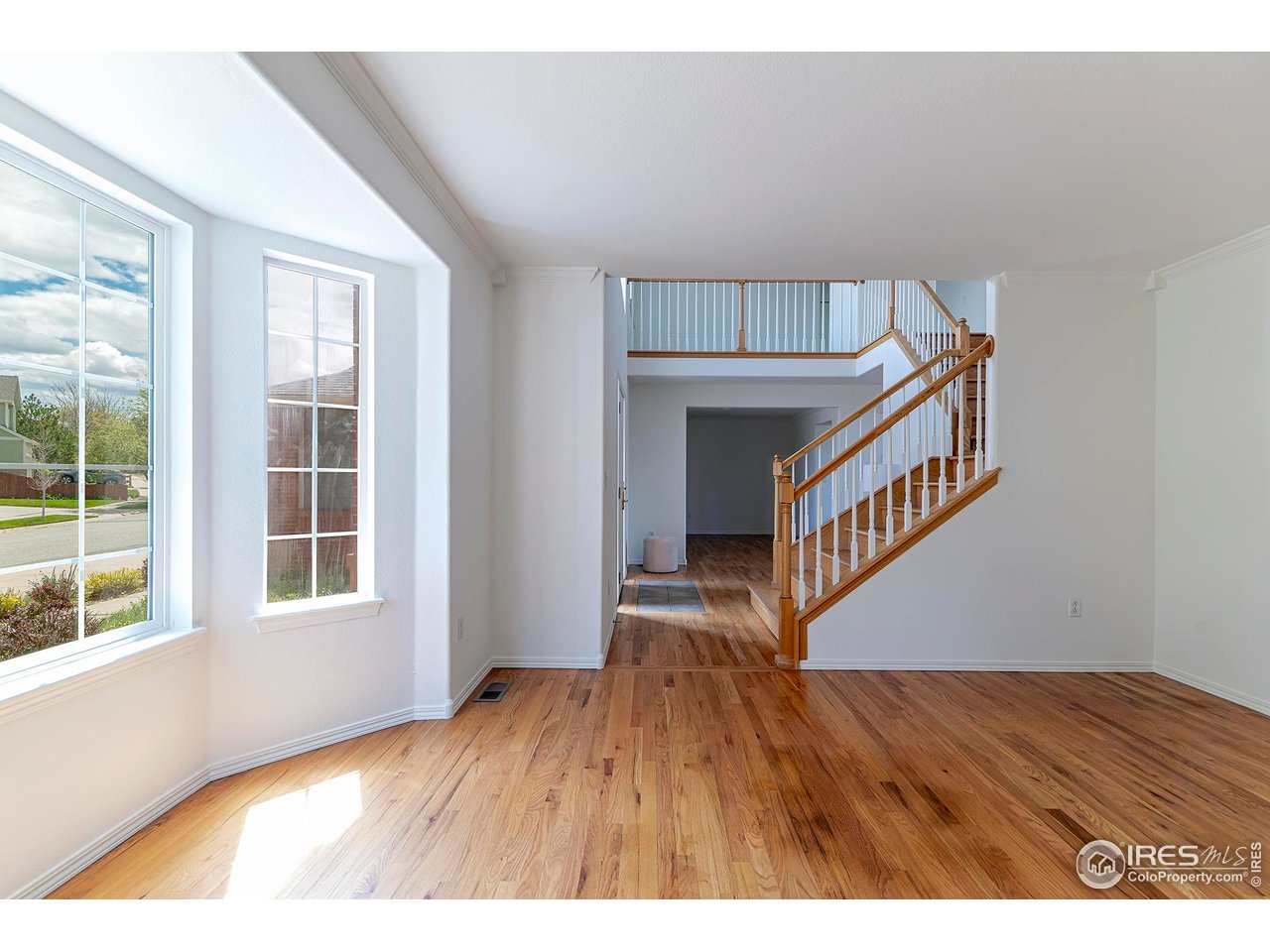 1414 Hoffman Drive Erie, CO 80516 - Photo 21 of 37 a view of an entryway with wooden floor