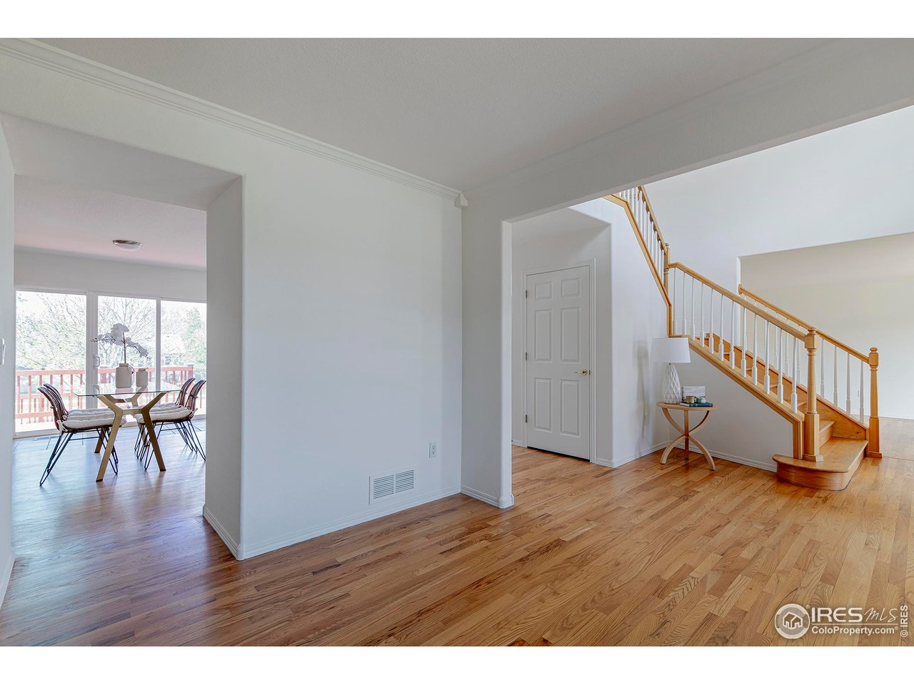 1414 Hoffman Drive Erie, CO 80516 - Photo 23 of 37 a view of an entryway with wooden floor