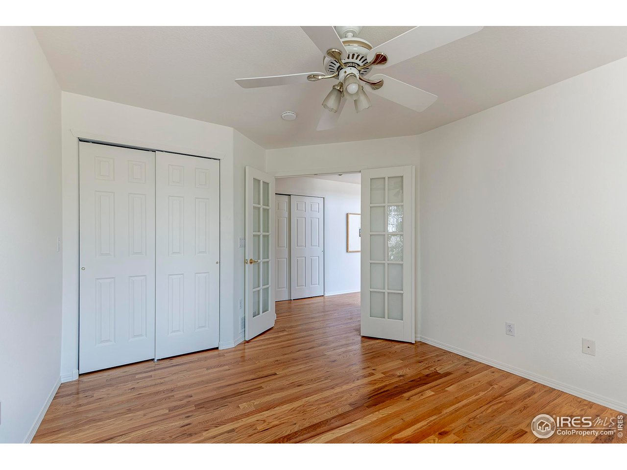 1414 Hoffman Drive Erie, CO 80516 - Photo 25 of 37 a view of an empty room and wooden floor