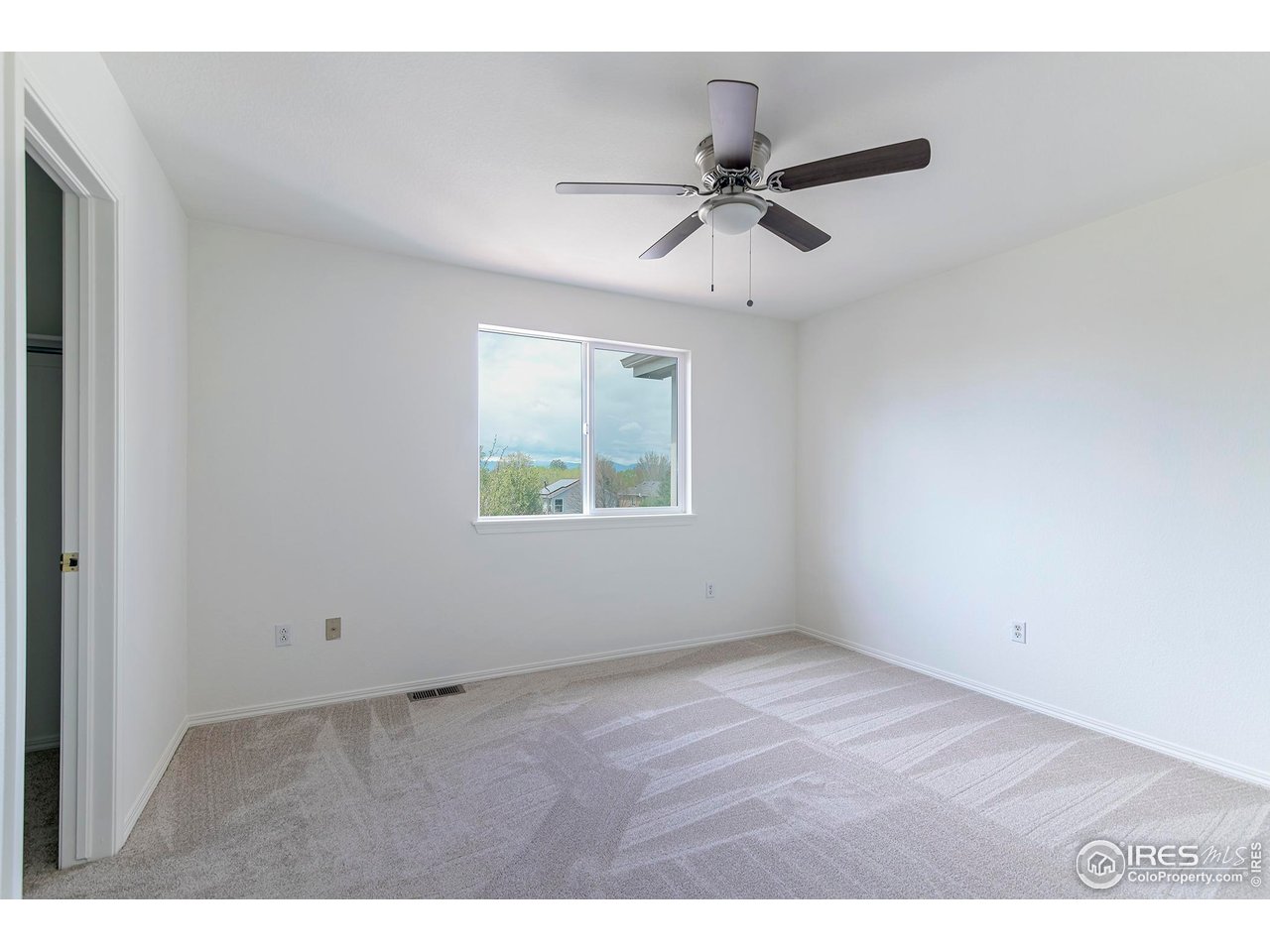 1414 Hoffman Drive Erie, CO 80516 - Photo 30 of 37 a view of an empty room with a window