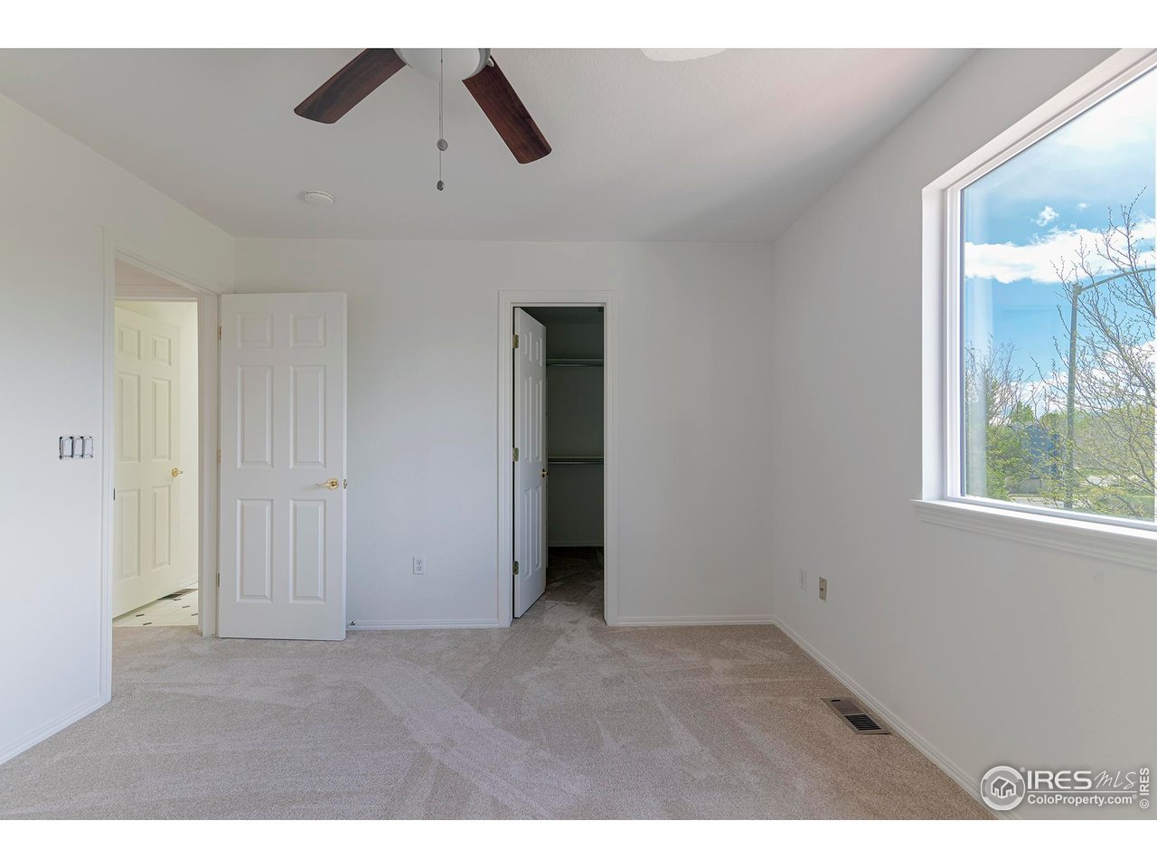 1414 Hoffman Drive Erie, CO 80516 - Photo 31 of 37 a view of an empty room with a window