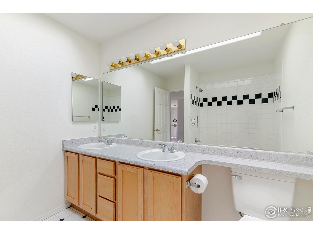 1414 Hoffman Drive Erie, CO 80516 - Photo 32 of 37 a bathroom with a sink and a mirror