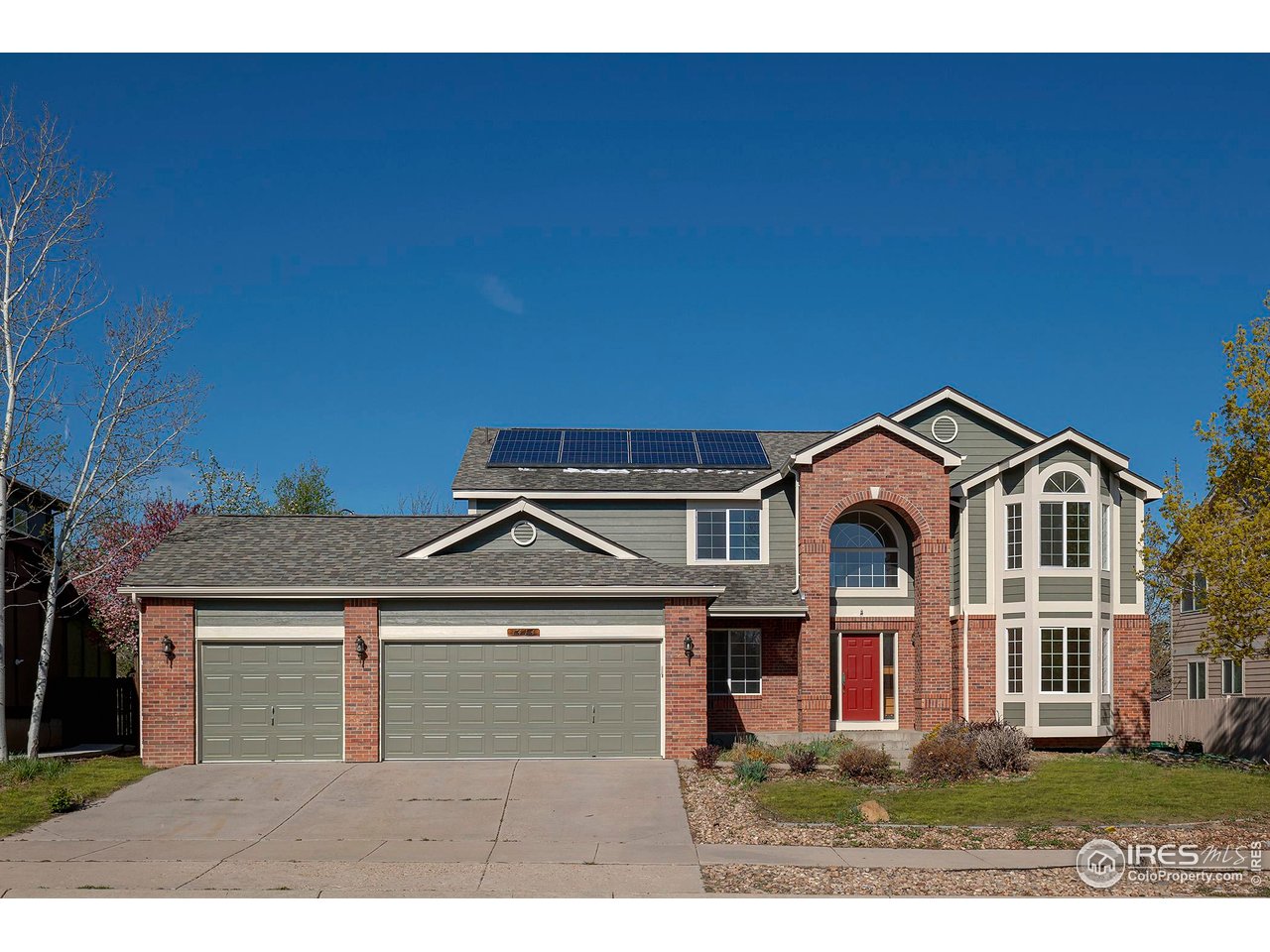 1414 Hoffman Drive Erie, CO 80516 - Photo 34 of 37 a front view of a house with a yard