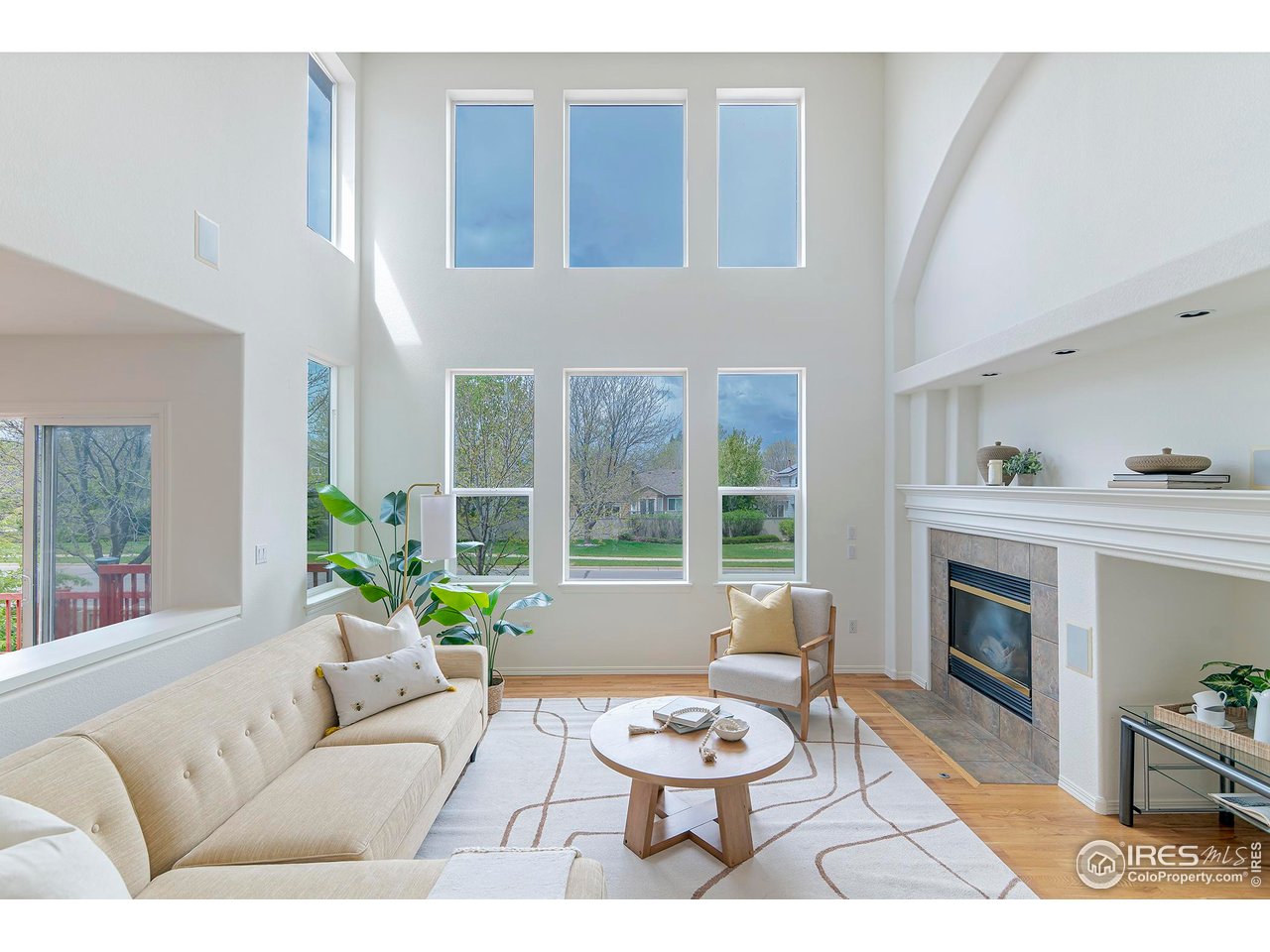 1414 Hoffman Drive Erie, CO 80516 - Photo 4 of 37 a living room with furniture a fireplace and a table