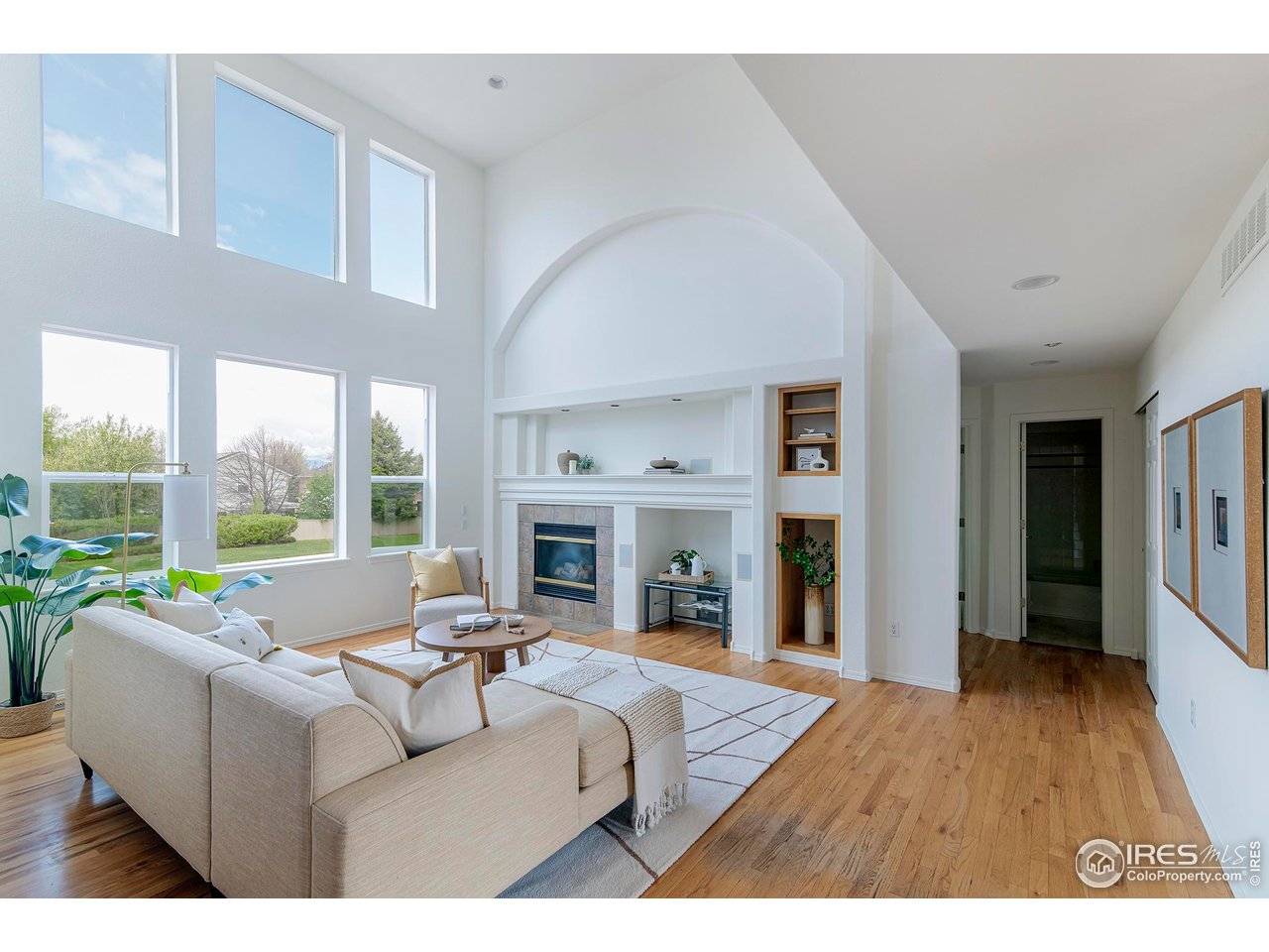 1414 Hoffman Drive Erie, CO 80516 - Photo 5 of 37 a living room with fireplace furniture and a large window