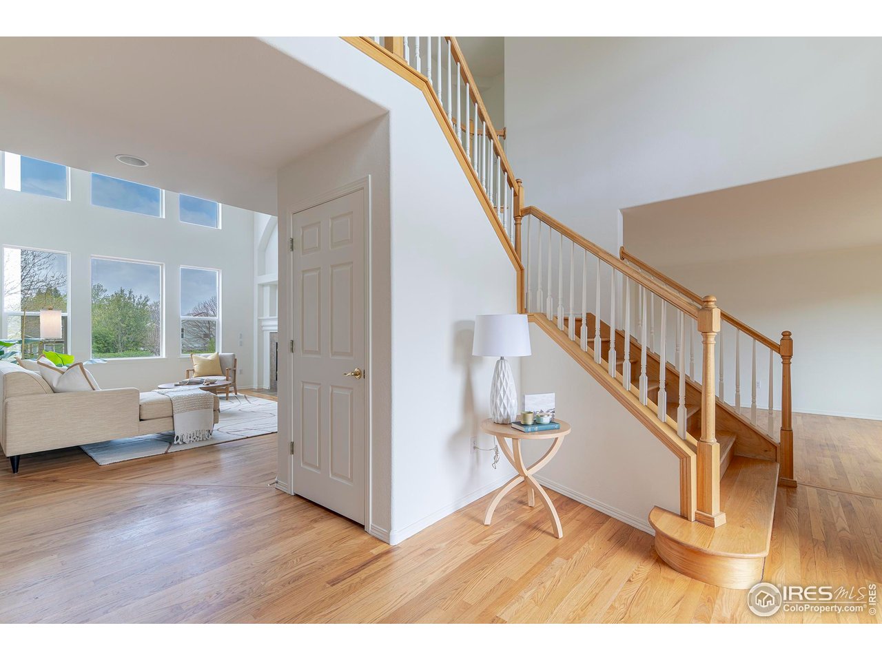 1414 Hoffman Drive Erie, CO 80516 - Photo 6 of 37 a view of entryway and hall with wooden floor