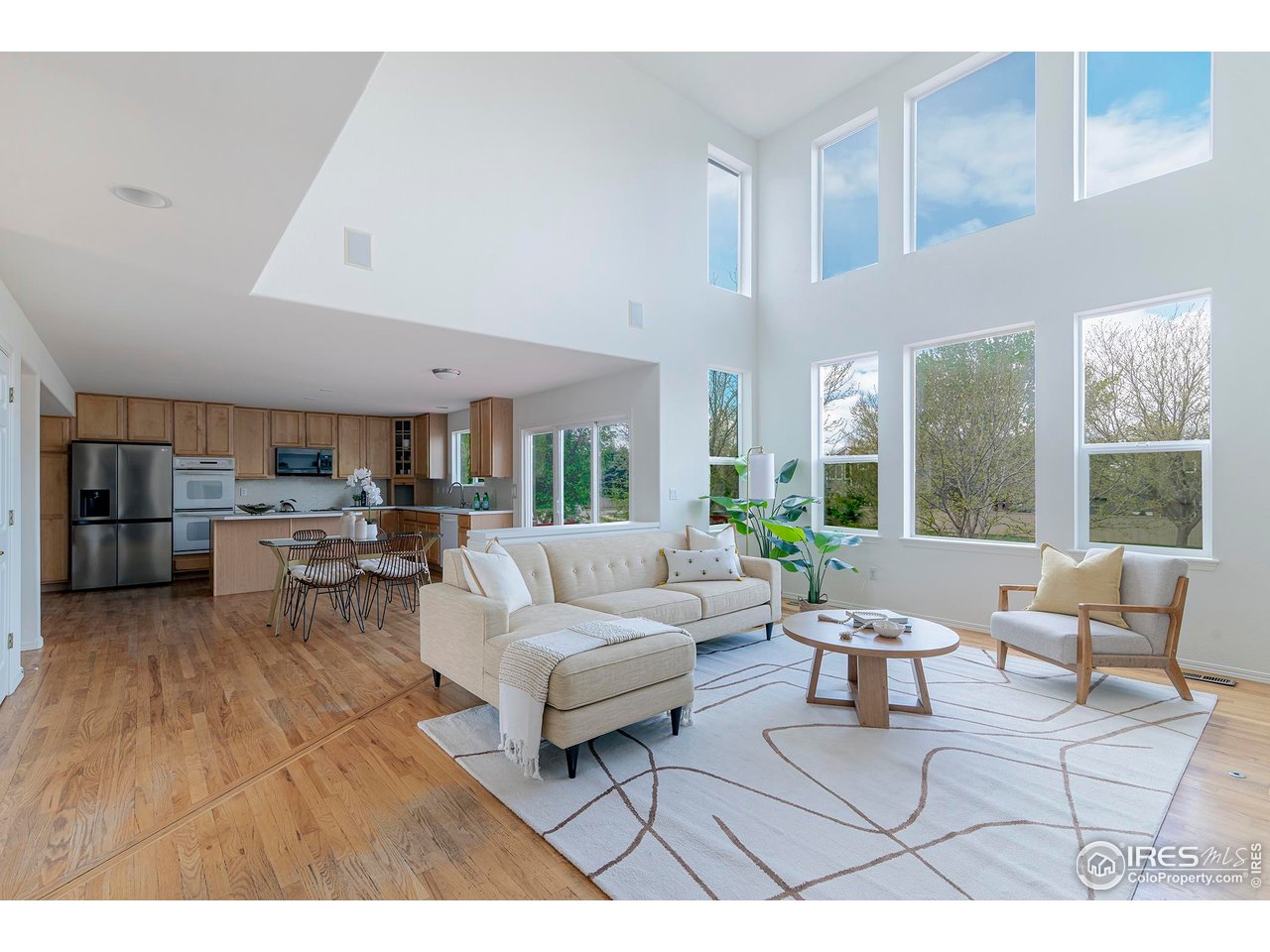 1414 Hoffman Drive Erie, CO 80516 - Photo 7 of 37 a living room with furniture and a large window