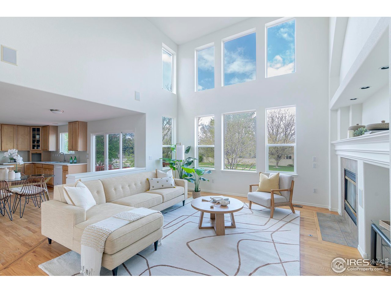 1414 Hoffman Drive Erie, CO 80516 - Photo 9 of 37 a living room with fireplace furniture and a large window