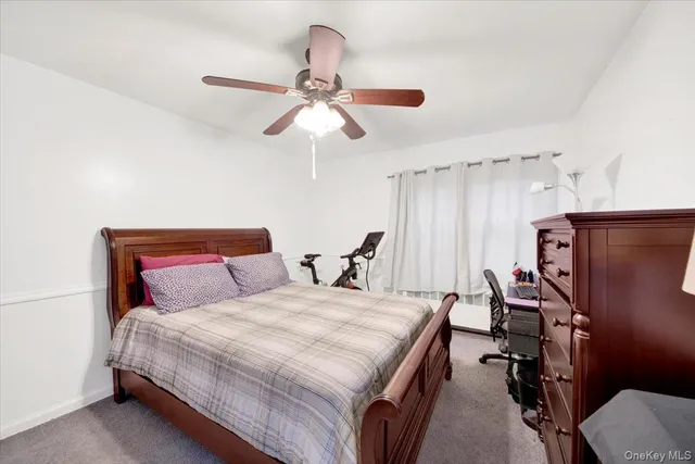 a bathroom with a sink a mirror and a shower curtain