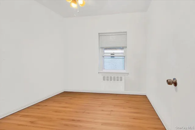 a view of a room with wooden floor and small space