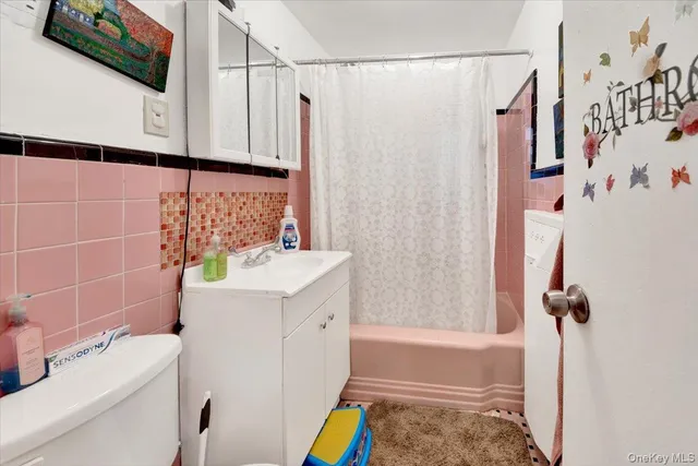 a kitchen with stainless steel appliances granite countertop a stove top oven a sink dishwasher and cabinets with wooden floor