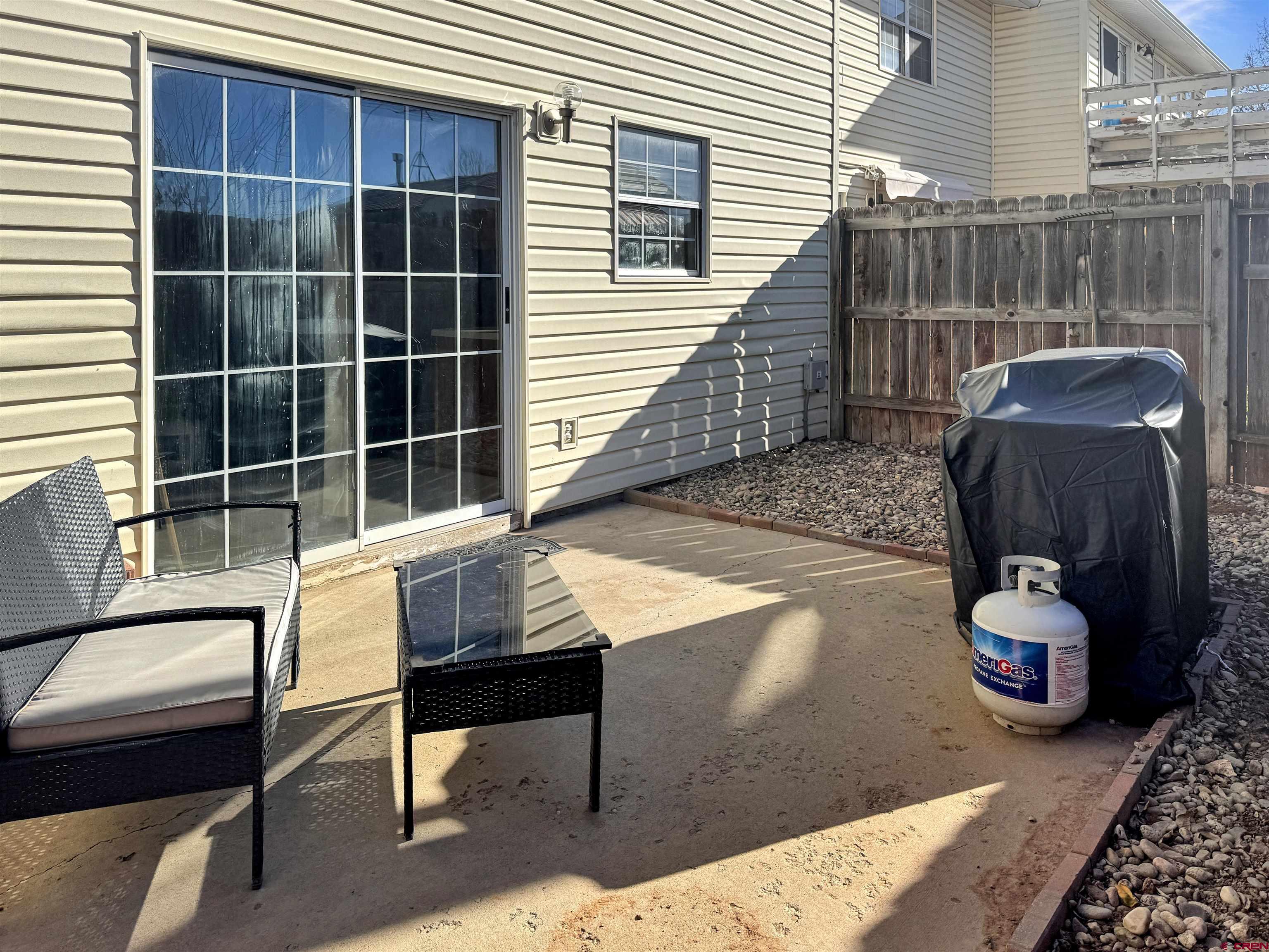 520 West 6th Street, Unit 15 Cortez, CO 81321 - Photo 21 of 22 a view of a deck with a chair and potted plant