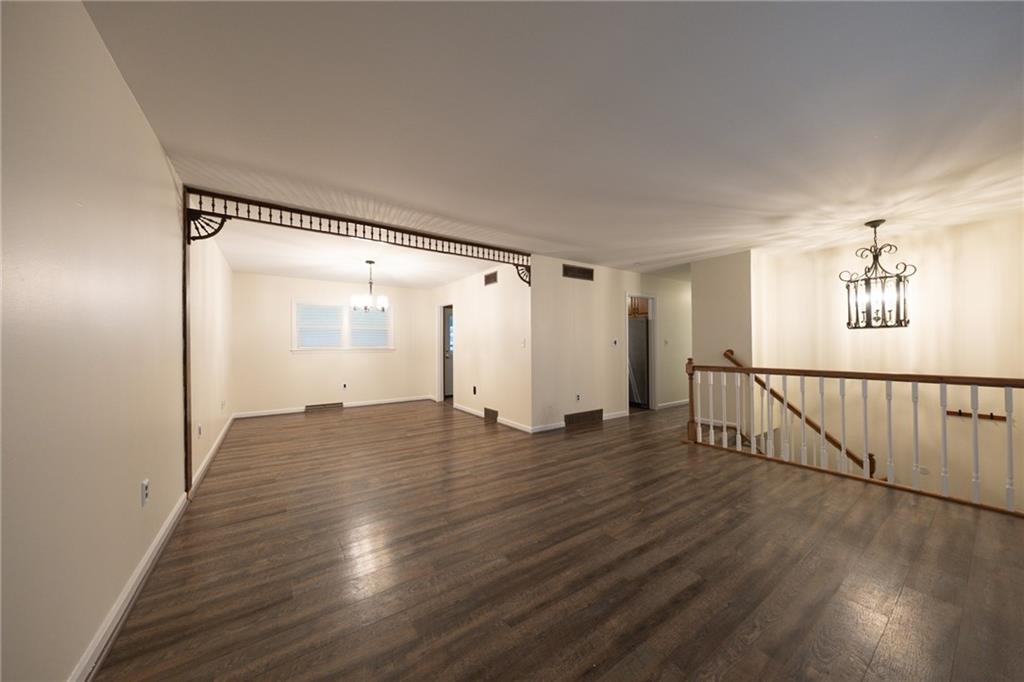 129 Green Brae Road Kittanning, PA 16201 - Photo 2 of 34 Living room area with updated flooring open to dining area