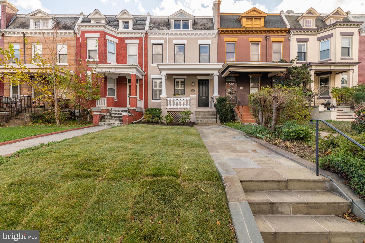 1352 Spring Road Northwest Washington, DC 20010 - Photo 1 of 14 a view of a building with a yard