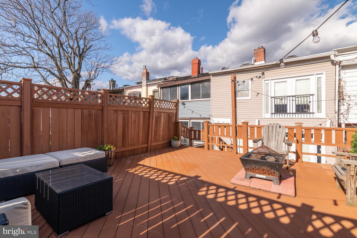 1352 Spring Road Northwest Washington, DC 20010 - Photo 6 of 14 a backyard of a house with table and chairs