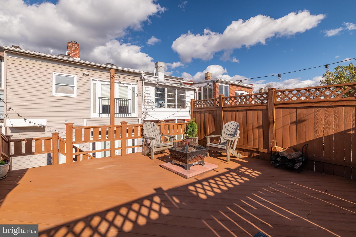 1352 Spring Road Northwest Washington, DC 20010 - Photo 8 of 14 a roof deck with table and chairs