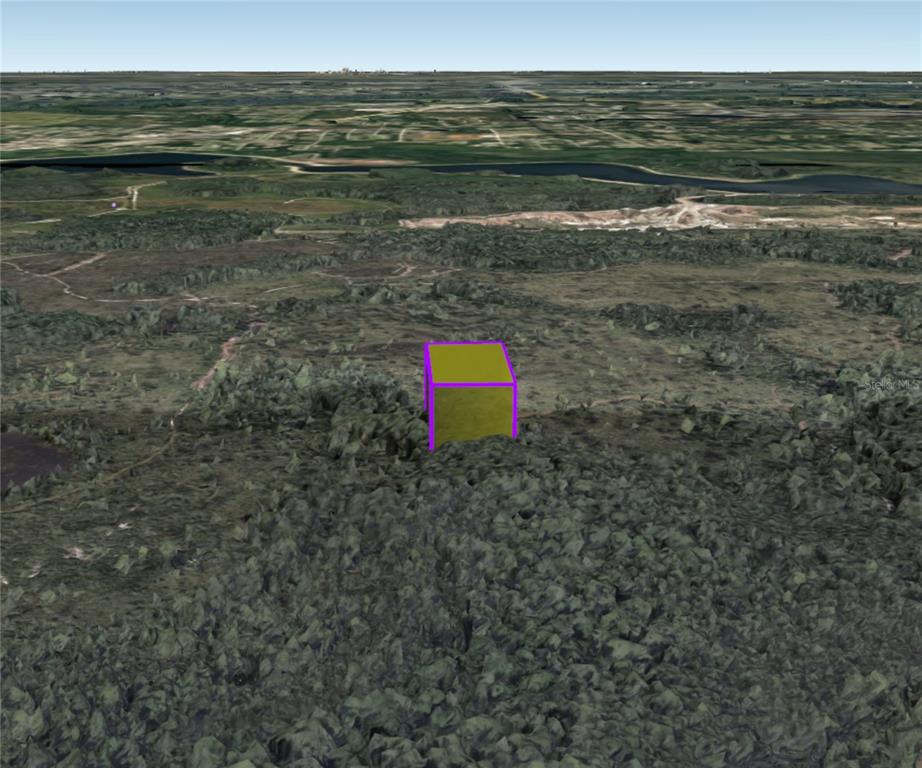 3460 Dill Road Christmas, FL 32709 - Photo 7 of 11 a view of a lake with beach and city view