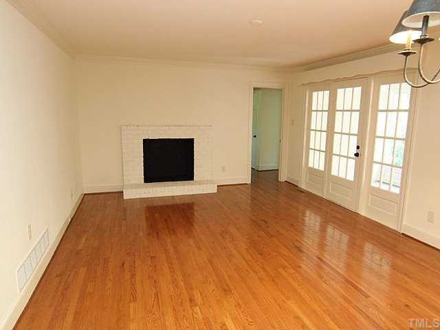 6616 Pleasant Pines Drive Raleigh, NC 27613 - Photo 6 of 15 Family room w/ hardwood floors and fireplace is open to the kitchen. Den/Family/Great Room