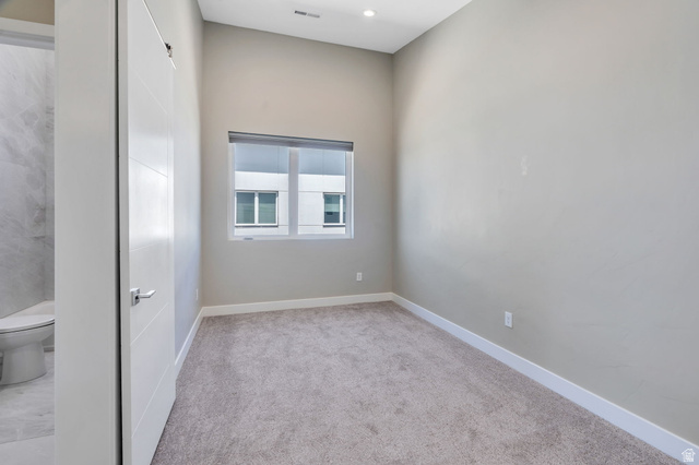 7045 South 300 East Midvale, UT 84047 - Photo 25 of 49 Carpeted room featuring a window with horizontal blinds, light gray walls, white baseboards, and a recessed light fixture