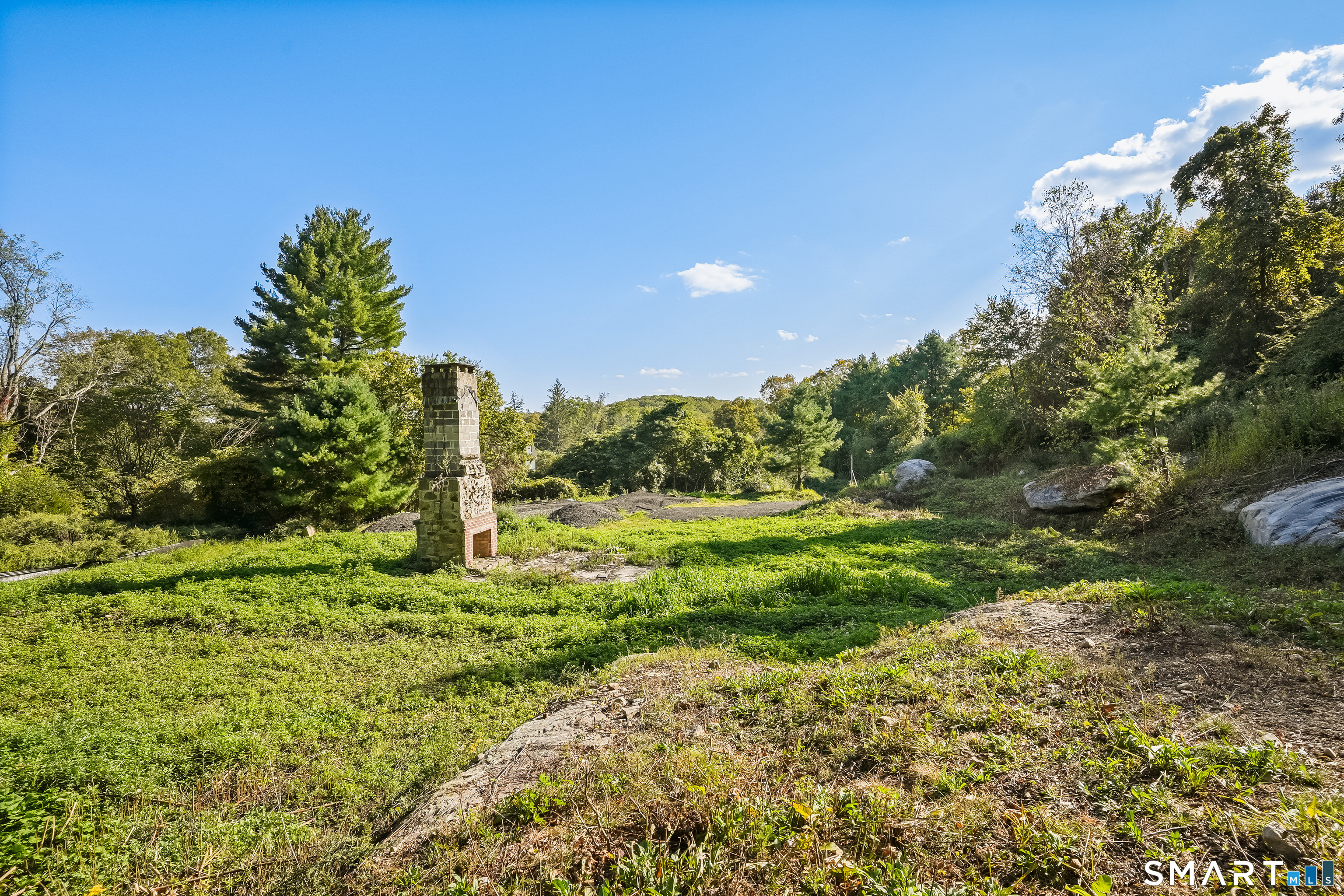 96 Georgetown Road Weston, CT 06883 - Photo 8 of 18 a big yard with lots of green space and plants