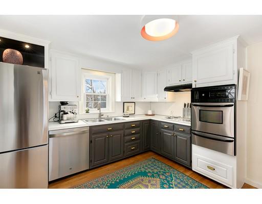 78 Cumberland Road Newton, MA 02465 - Photo 14 of 30 a kitchen with stainless steel appliances granite countertop a sink a stove a refrigerator a microwave and cabinets