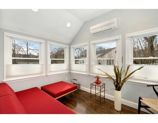 78 Cumberland Road Newton, MA 02465 - Photo 9 of 30 a living room with furniture bookshelf and a large window