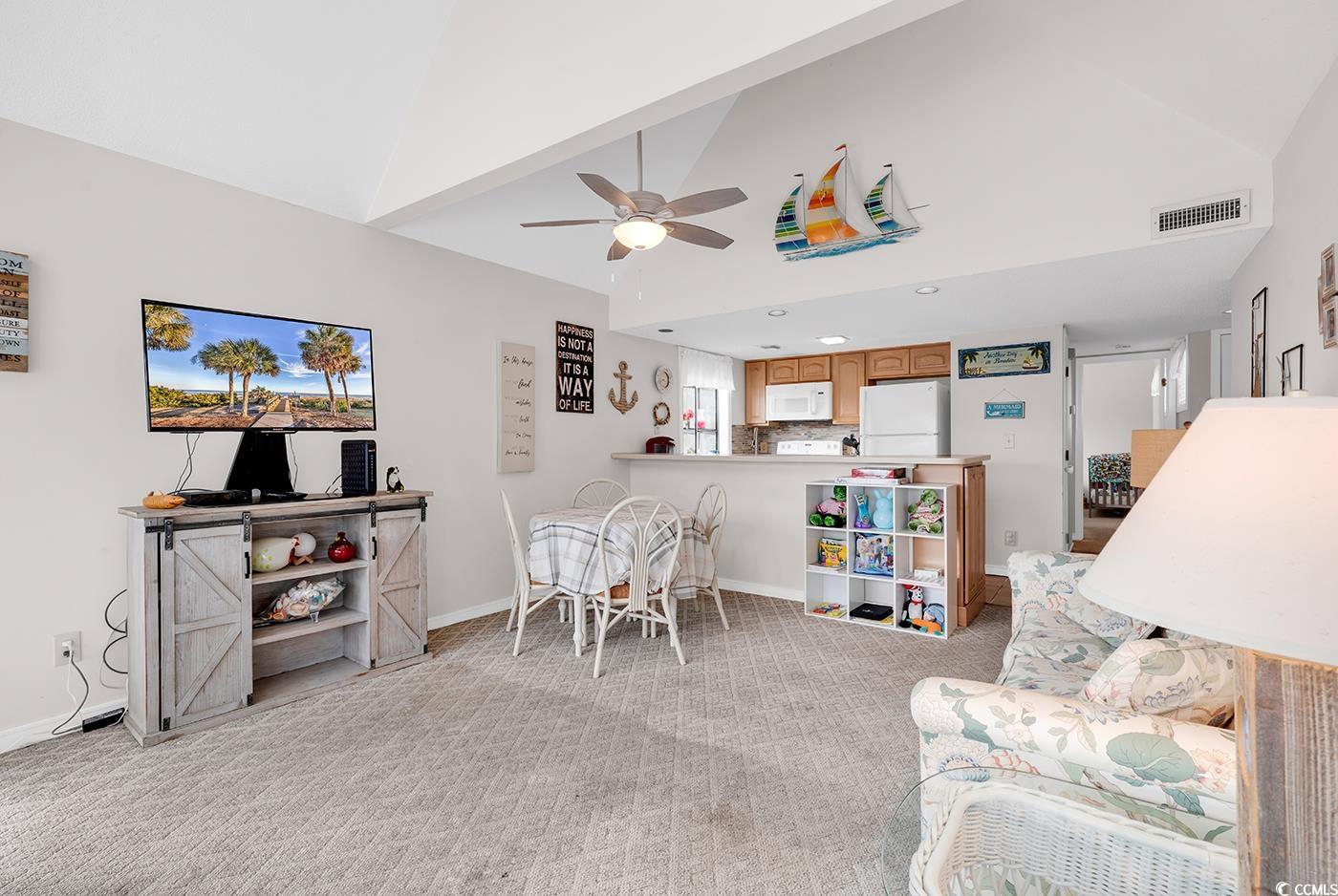 351 Lake Arrowhead Road, Unit 12347 Myrtle Beach, SC 29572 - Photo 12 of 36 Living area featuring high vaulted ceiling, light