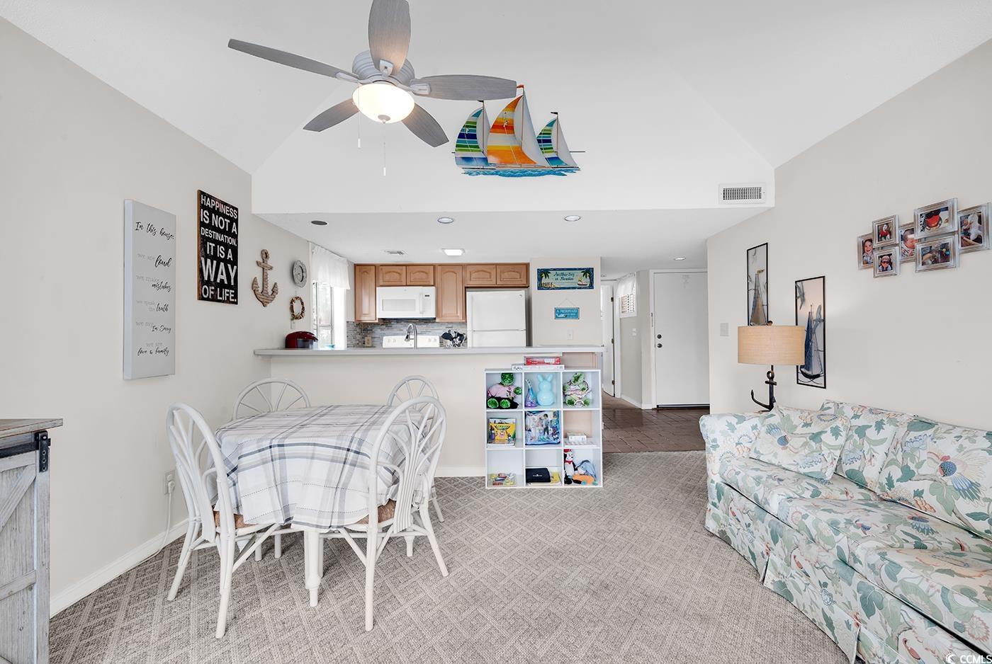 351 Lake Arrowhead Road, Unit 12347 Myrtle Beach, SC 29572 - Photo 13 of 36 Dining room featuring light colored carpet, visibl