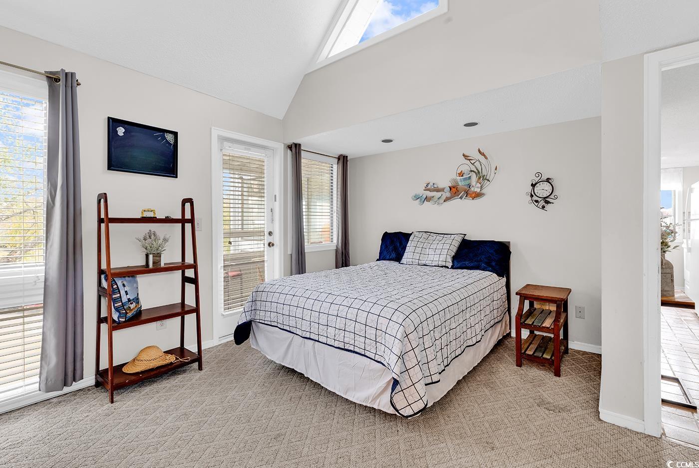 351 Lake Arrowhead Road, Unit 12347 Myrtle Beach, SC 29572 - Photo 17 of 36 Bedroom with lofted ceiling, light carpet, and bas