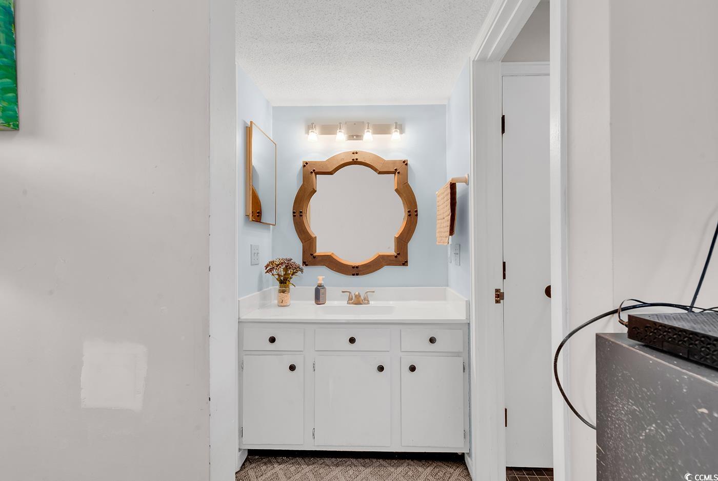 351 Lake Arrowhead Road, Unit 12347 Myrtle Beach, SC 29572 - Photo 19 of 36 Bathroom with a textured ceiling and vanity