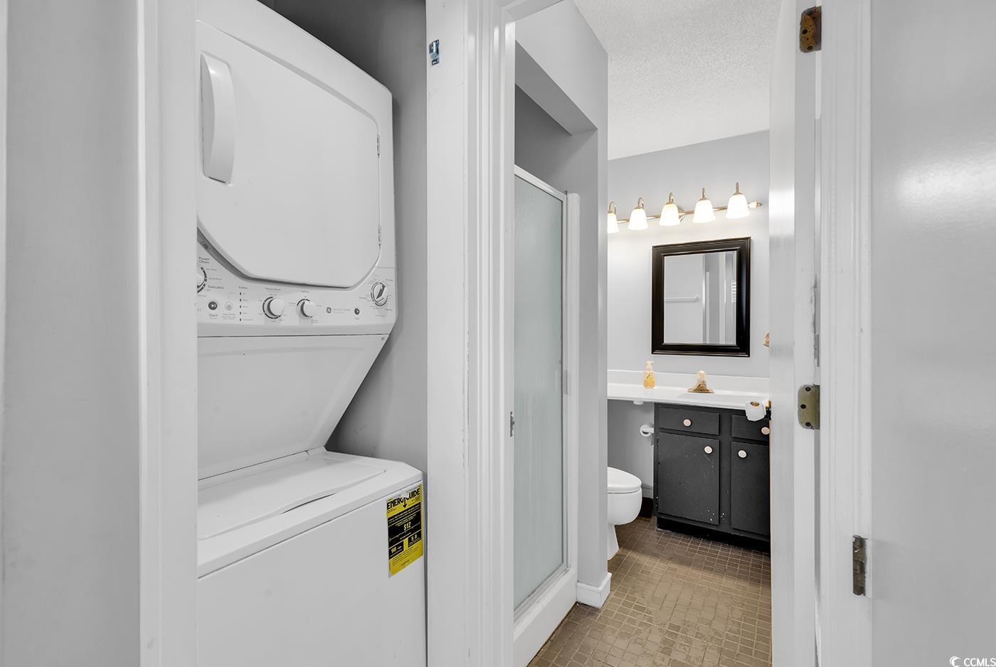 351 Lake Arrowhead Road, Unit 12347 Myrtle Beach, SC 29572 - Photo 26 of 36 Bathroom with a textured ceiling, toilet, stacked
