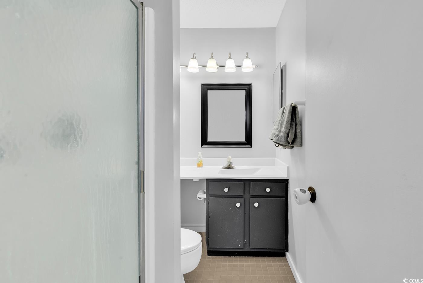 351 Lake Arrowhead Road, Unit 12347 Myrtle Beach, SC 29572 - Photo 27 of 36 Bathroom with toilet, an enclosed shower, baseboar