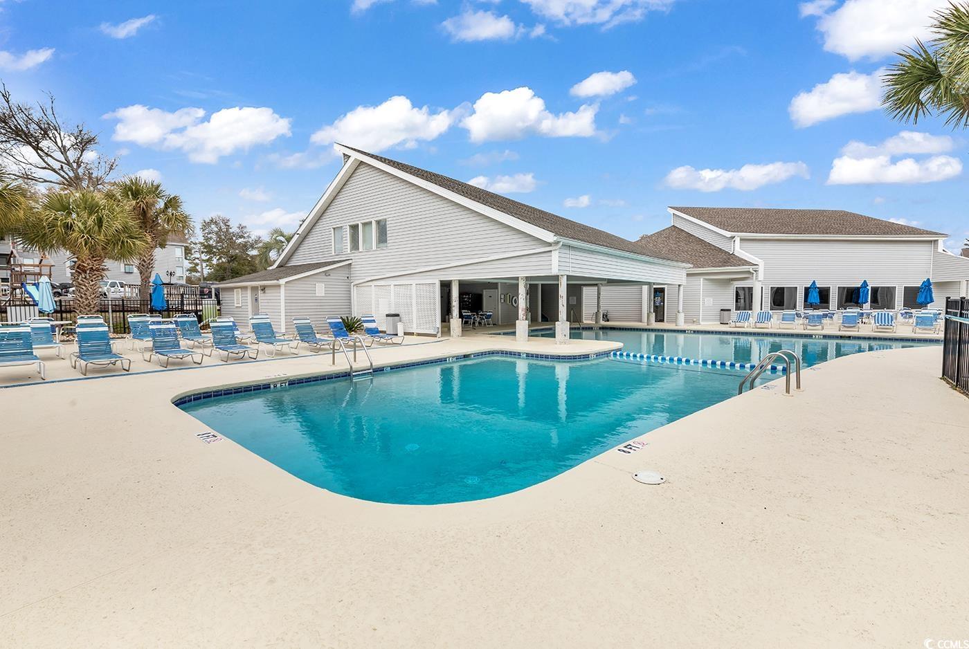 351 Lake Arrowhead Road, Unit 12347 Myrtle Beach, SC 29572 - Photo 31 of 36 Pool featuring a patio area and fence