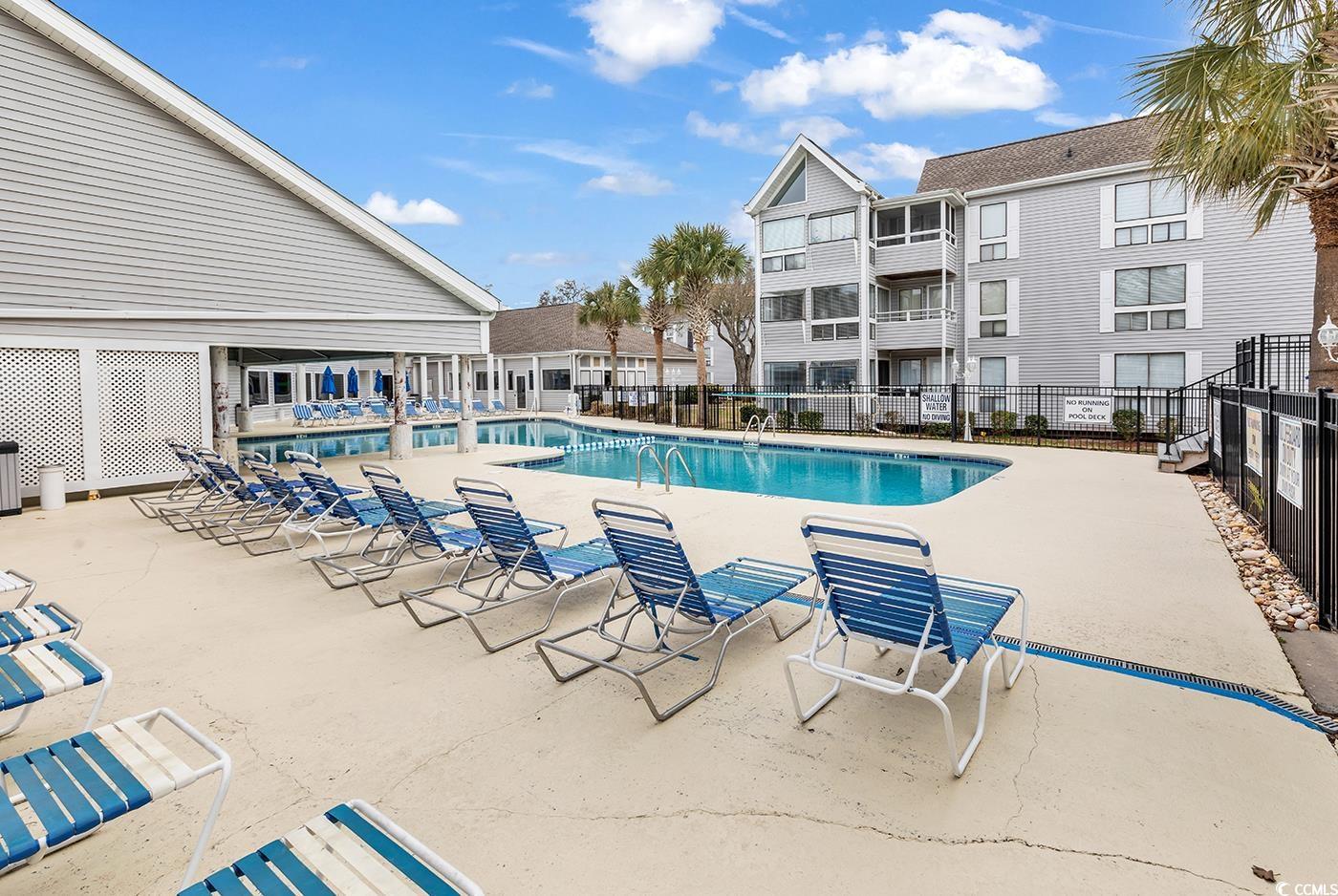 351 Lake Arrowhead Road, Unit 12347 Myrtle Beach, SC 29572 - Photo 32 of 36 Community pool featuring a patio and fence
