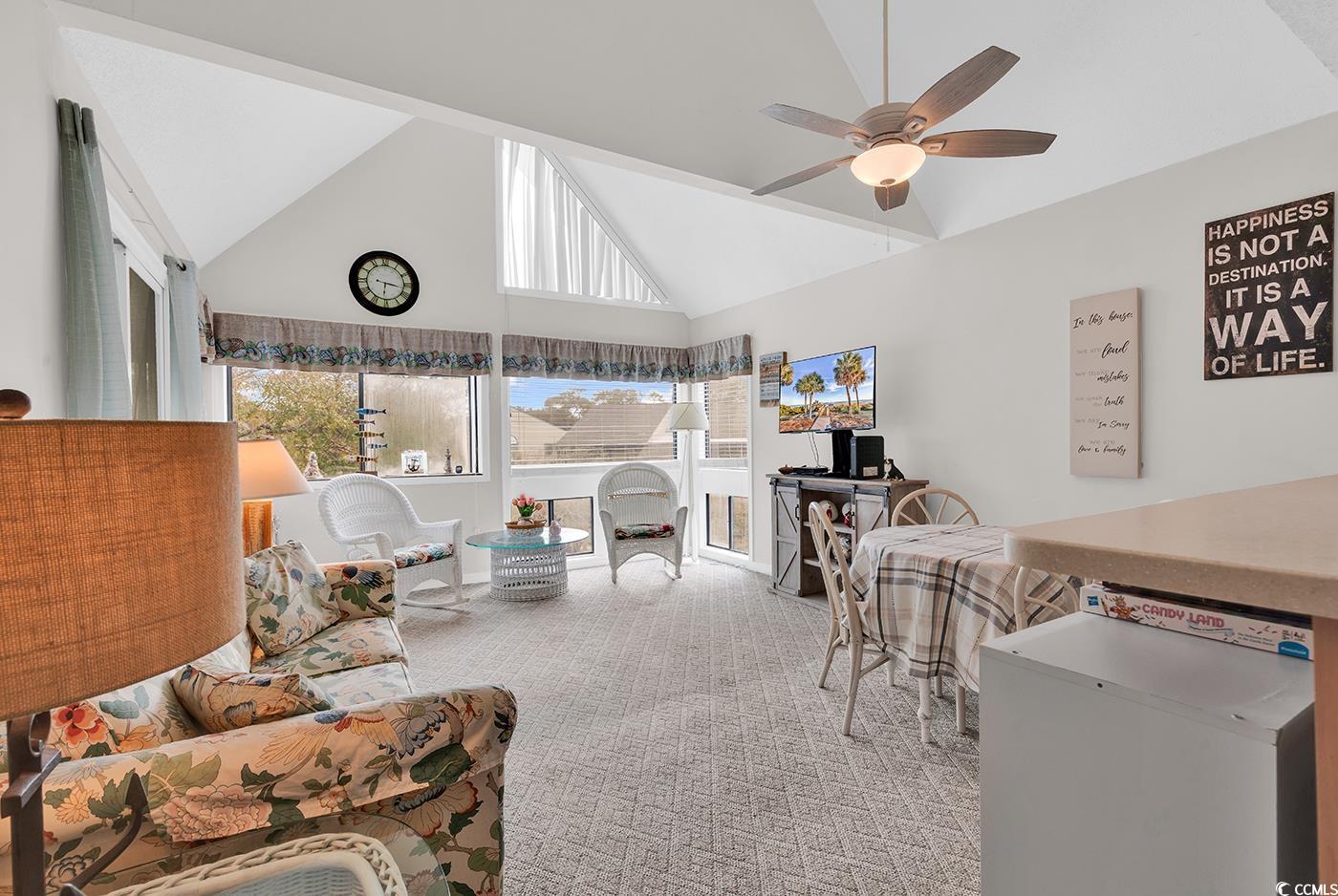351 Lake Arrowhead Road, Unit 12347 Myrtle Beach, SC 29572 - Photo 8 of 36 Carpeted living room with a ceiling fan, a sunroom
