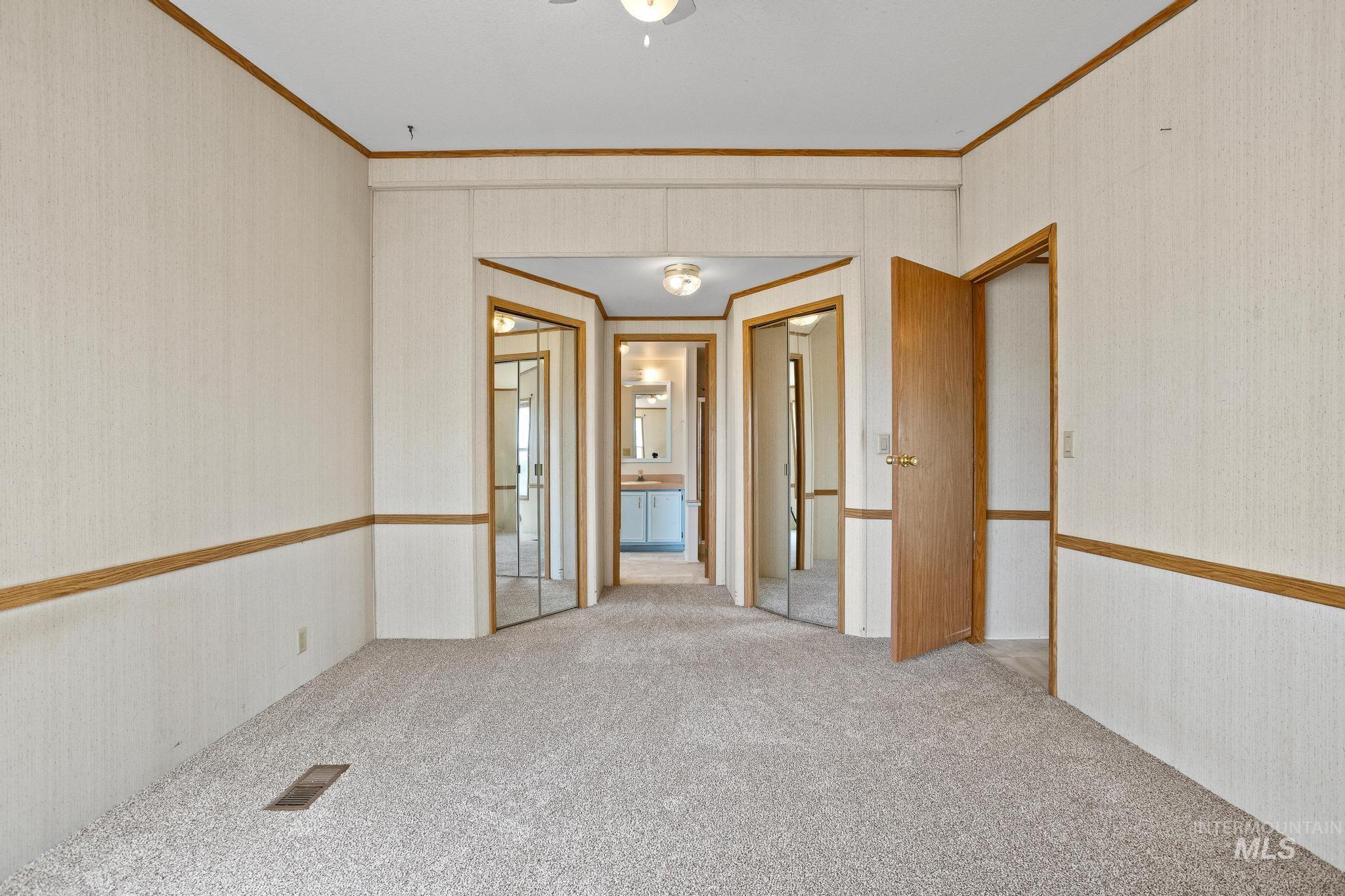 3680 South Mill Road Emmett, ID 83617 - Photo 27 of 38 Carpeted interior space featuring light-toned walls with wood trim