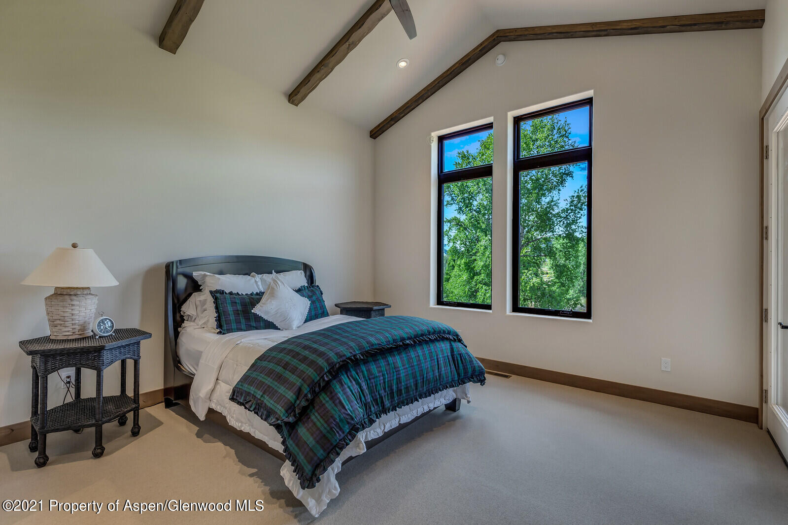 471 Boundary Lane Carbondale, CO 81623 - Photo 14 of 30 a bed sitting in a bedroom next to a window