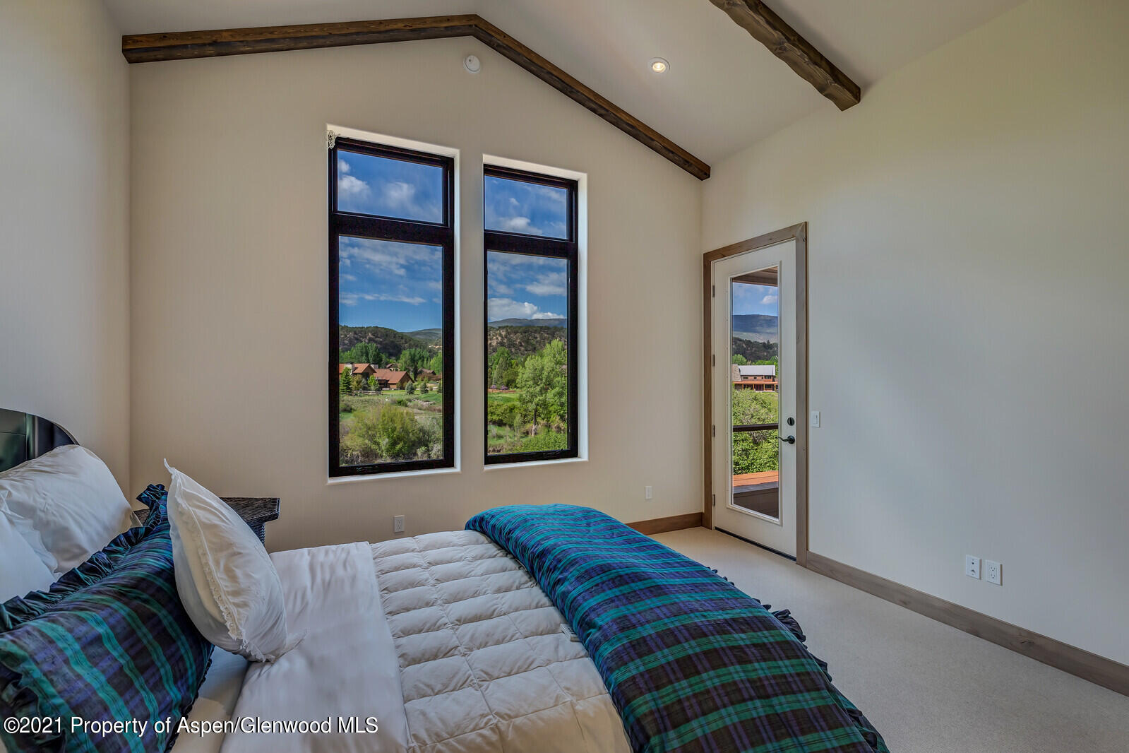 471 Boundary Lane Carbondale, CO 81623 - Photo 15 of 30 a bedroom with a bed and a window