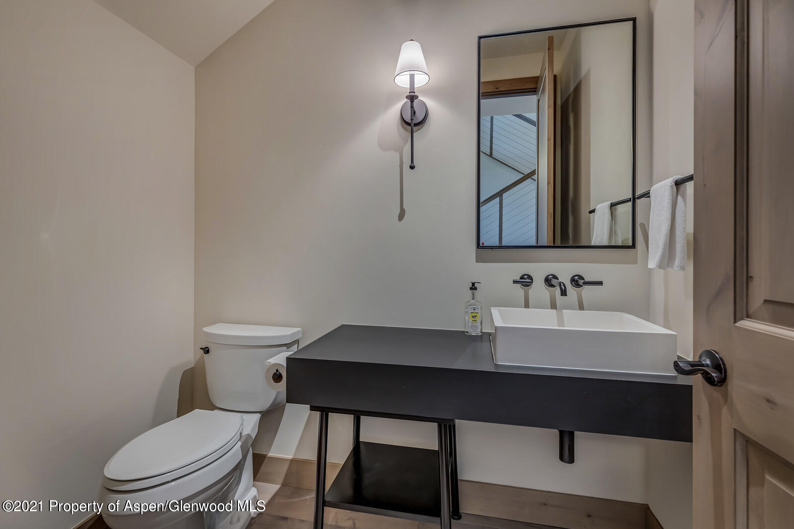 471 Boundary Lane Carbondale, CO 81623 - Photo 22 of 30 a bathroom with a toilet a sink and mirror
