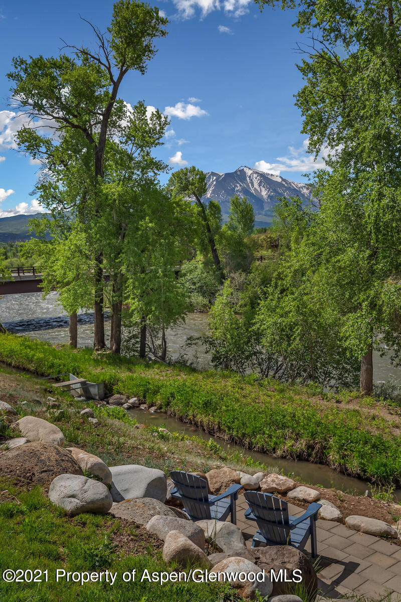 471 Boundary Lane Carbondale, CO 81623 - Photo 30 of 30 a view of a backyard with plants and lake
