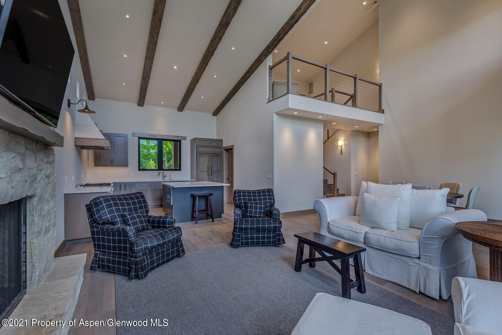471 Boundary Lane Carbondale, CO 81623 - Photo 4 of 30 a living room with furniture and a flat screen tv